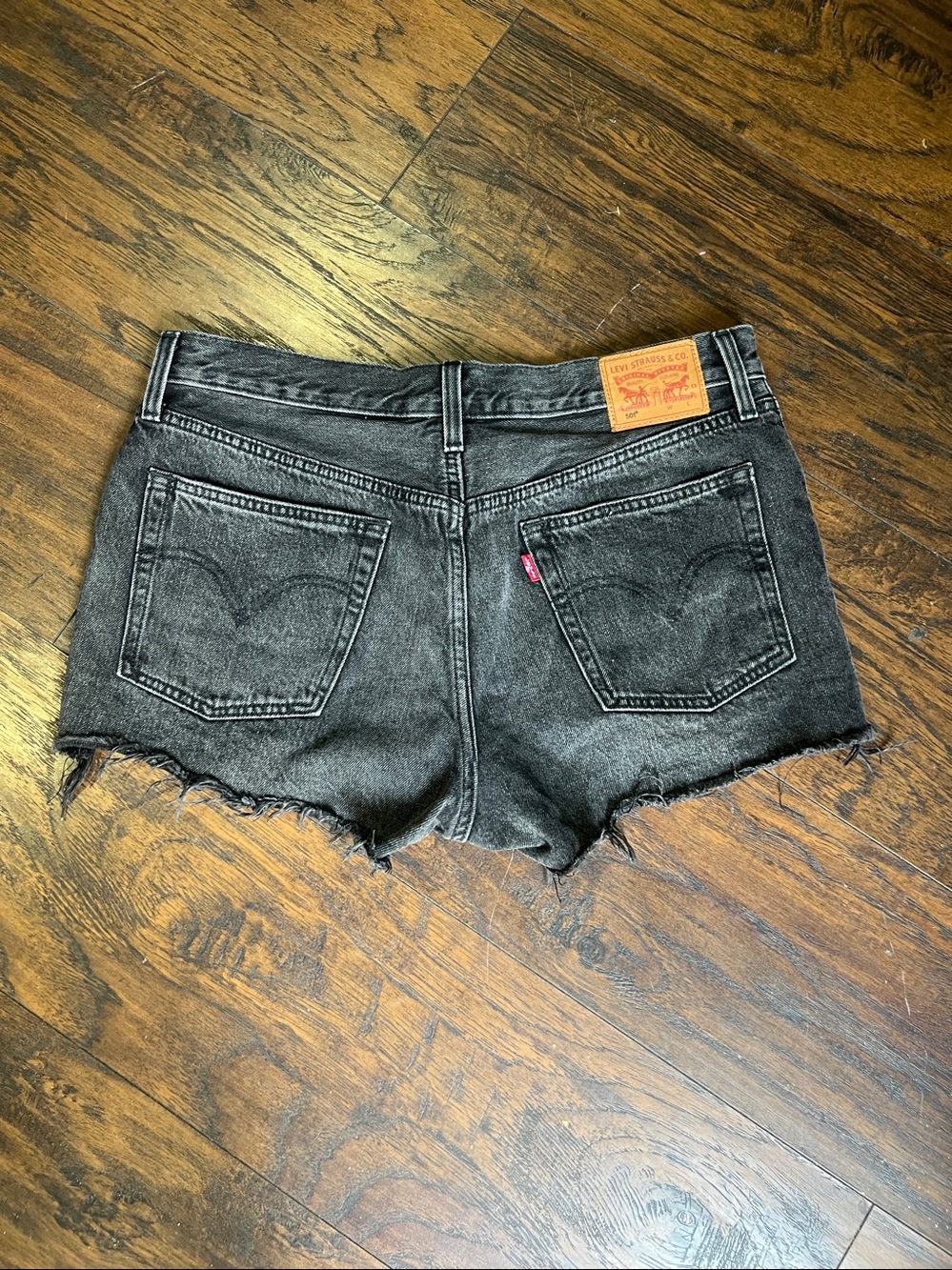 Levi’s 501 buttonfly  distressed shorty shorts faded black woman’s size 30